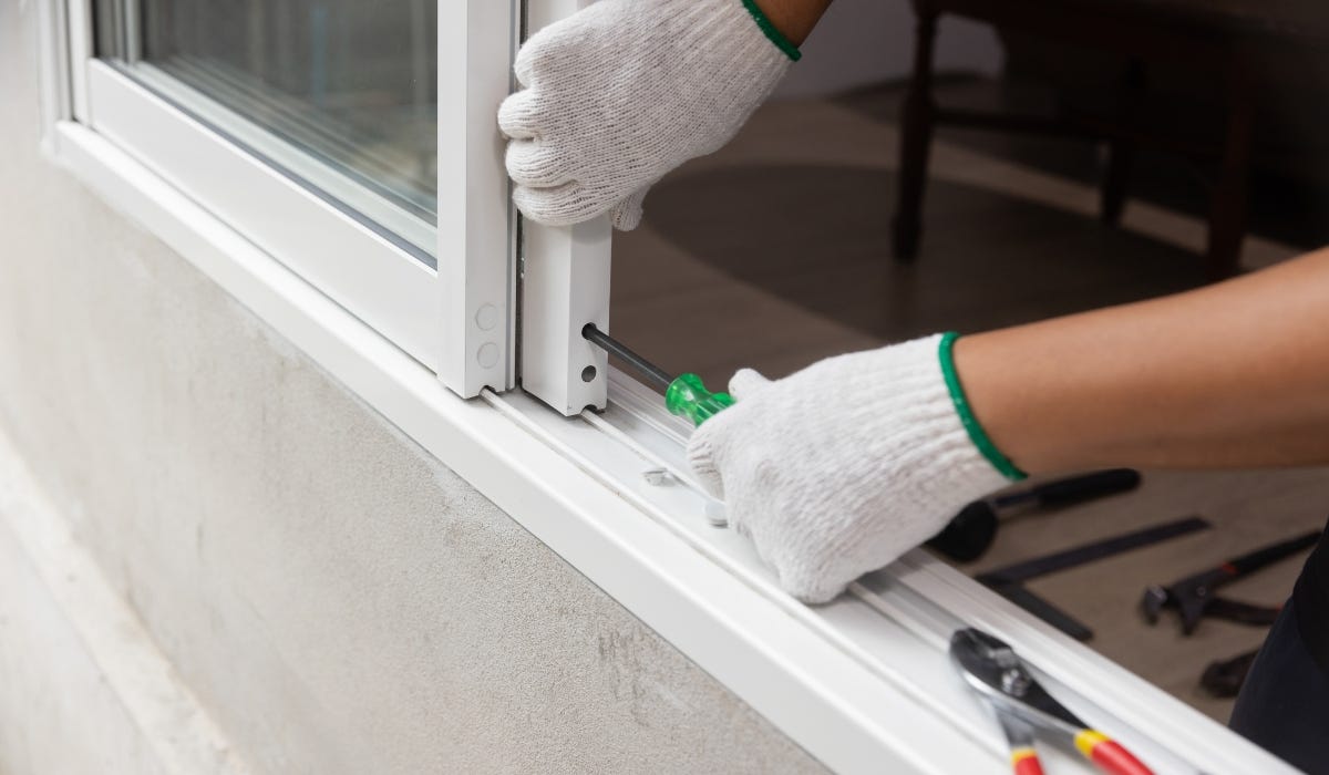 Putting new rollers on a sliding door